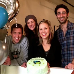 Stitch Labs co-founders Jake, Michelle, Willo and Brandon celebrating the funding with cake and balloons