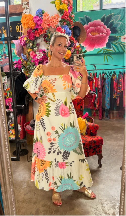 Willo Sana in a colorful floral dress at the hackathon